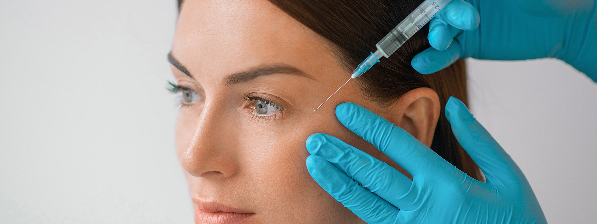 A beautiful woman is receiving a Botox/neurotoxin treatment.
