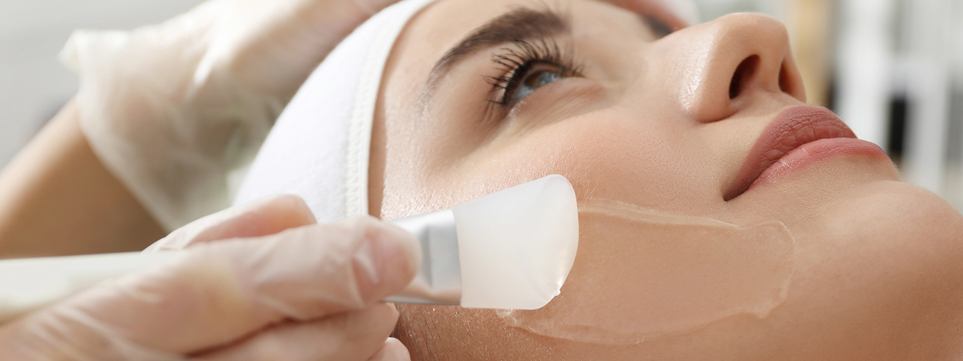 A beautiful woman is receiving a chemical peels treatment.