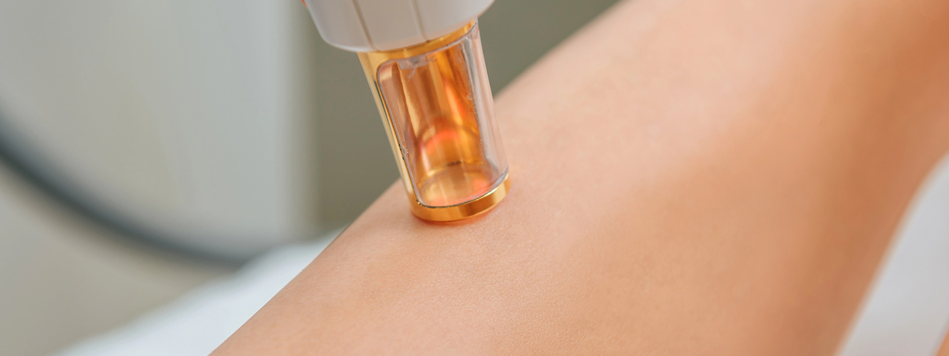 A beautiful woman is receiving laser hair removal treatment.